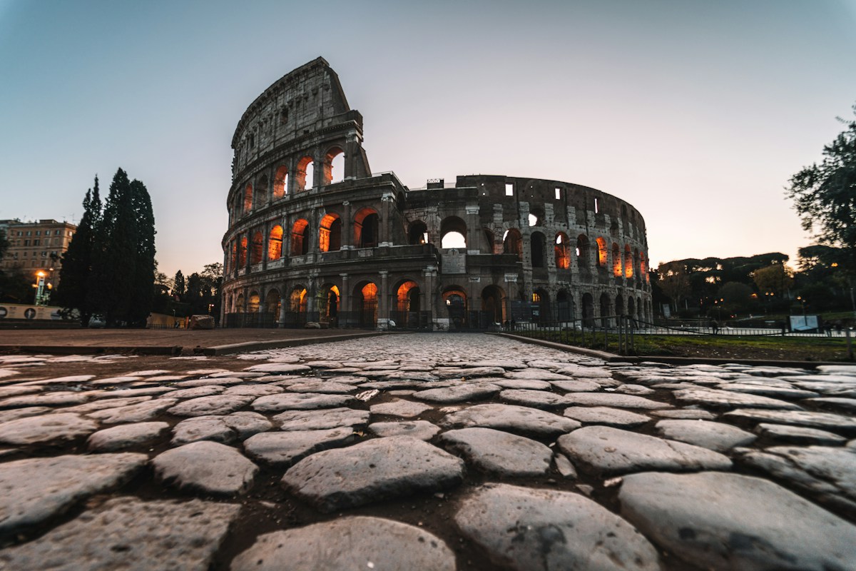 The Colosseum lit at dusk, the first stop in 3 days in Rome