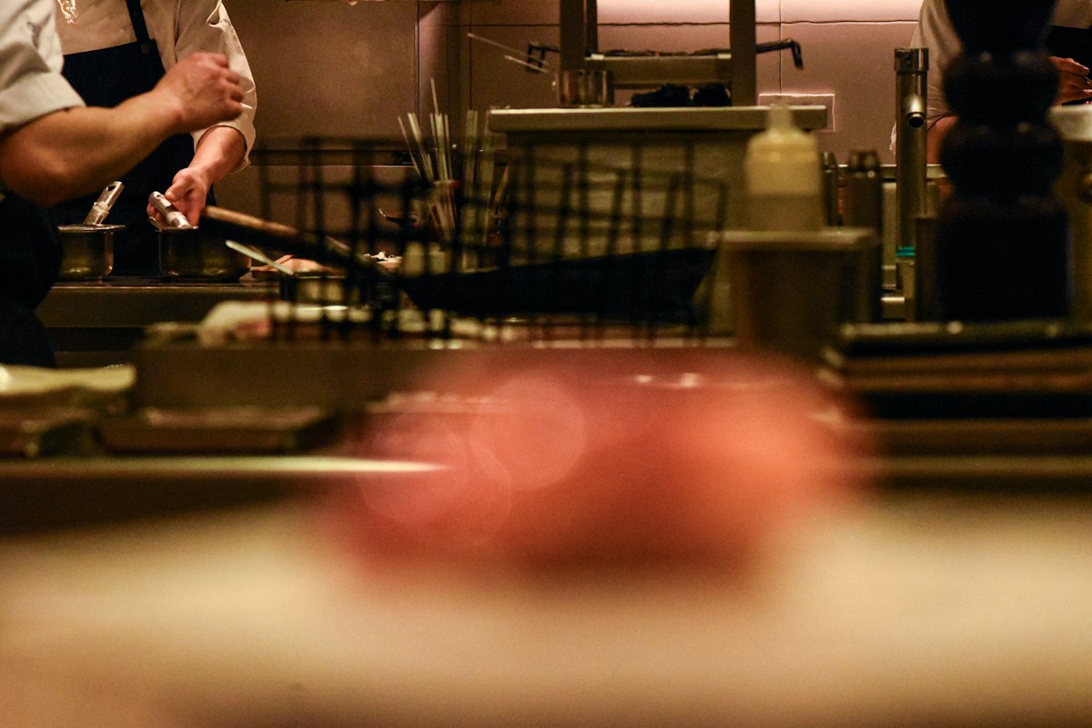 Chefs working in a professional kitchen, illustrating the Ein Prosit Udine 2026 guide