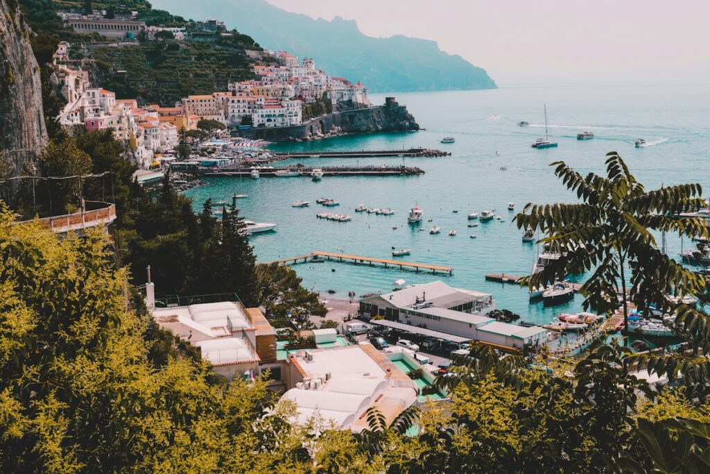 Harbor and cliffs of a coastal town on an Amalfi Coast itinerary
