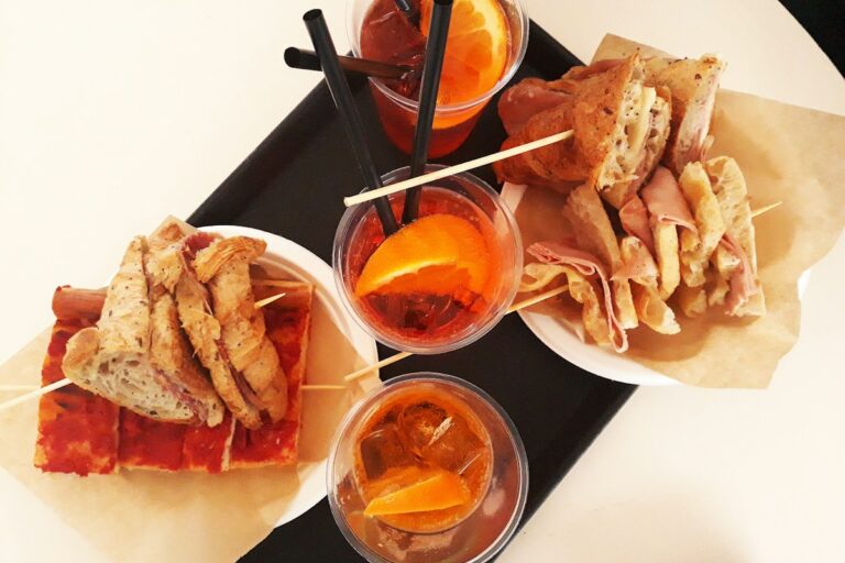 Aperitivo in Italy: a tray of snacks served with an Aperol Spritz