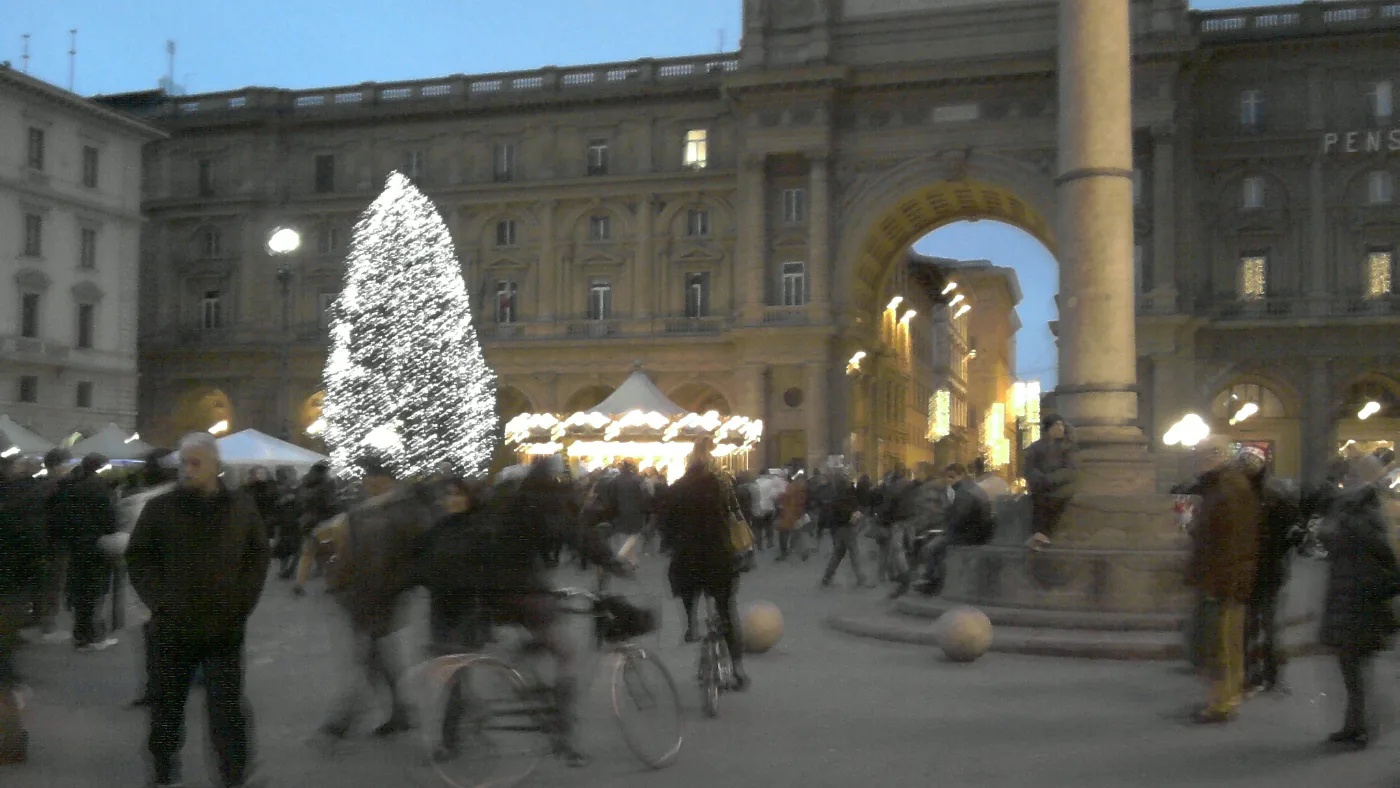 The Christmas tree lit up in Piazza della Repubblica, Florence, at dusk