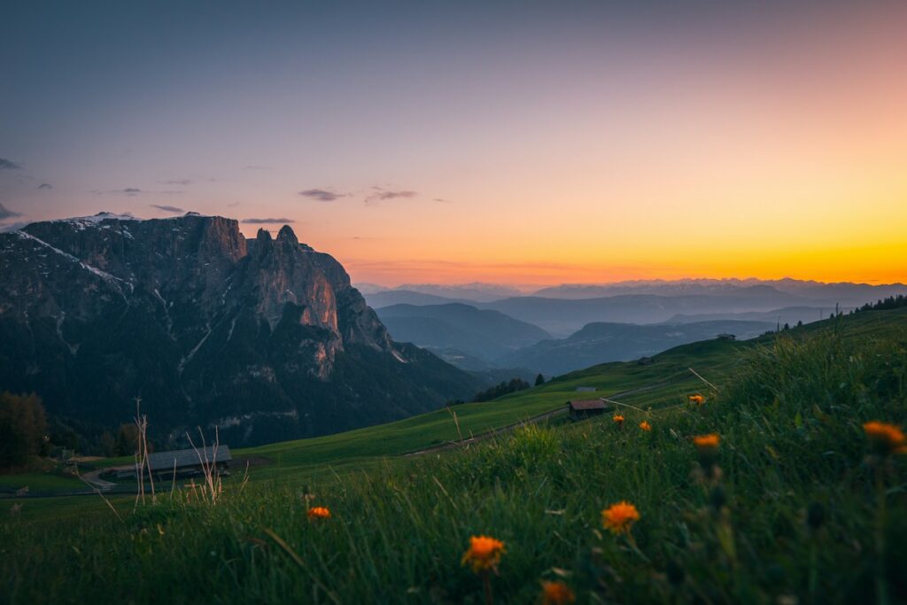 Sunset over the Alpe di Siusi meadow, a day of a Dolomites itinerary