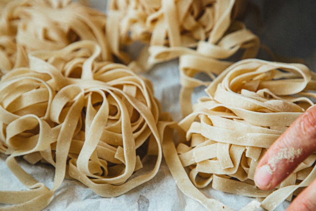Florence cooking class: shaping fresh pasta by hand with a wooden tool