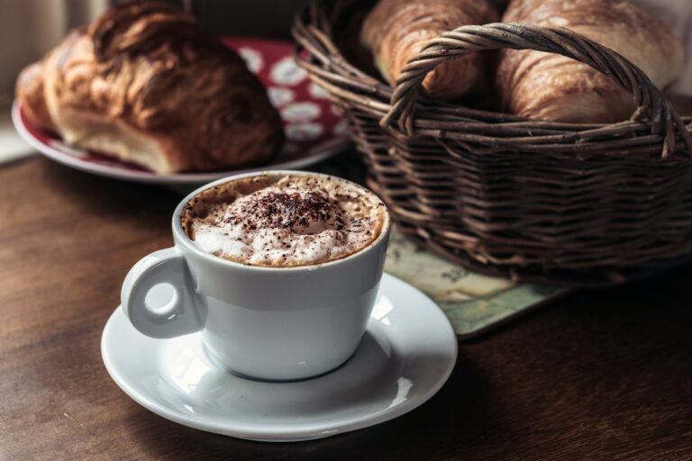 Cappuccino in a white cup, the classic drink of an Italian breakfast