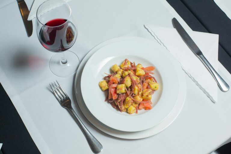 A plate of gnocchi with tomato, one of many Italian food facts on the table