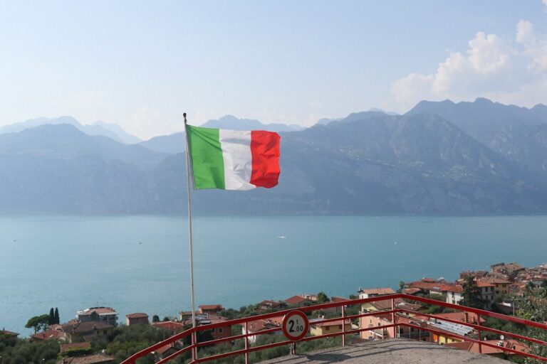 The Italian flag flying over a lake, a symbol linked to the Italian national anthem