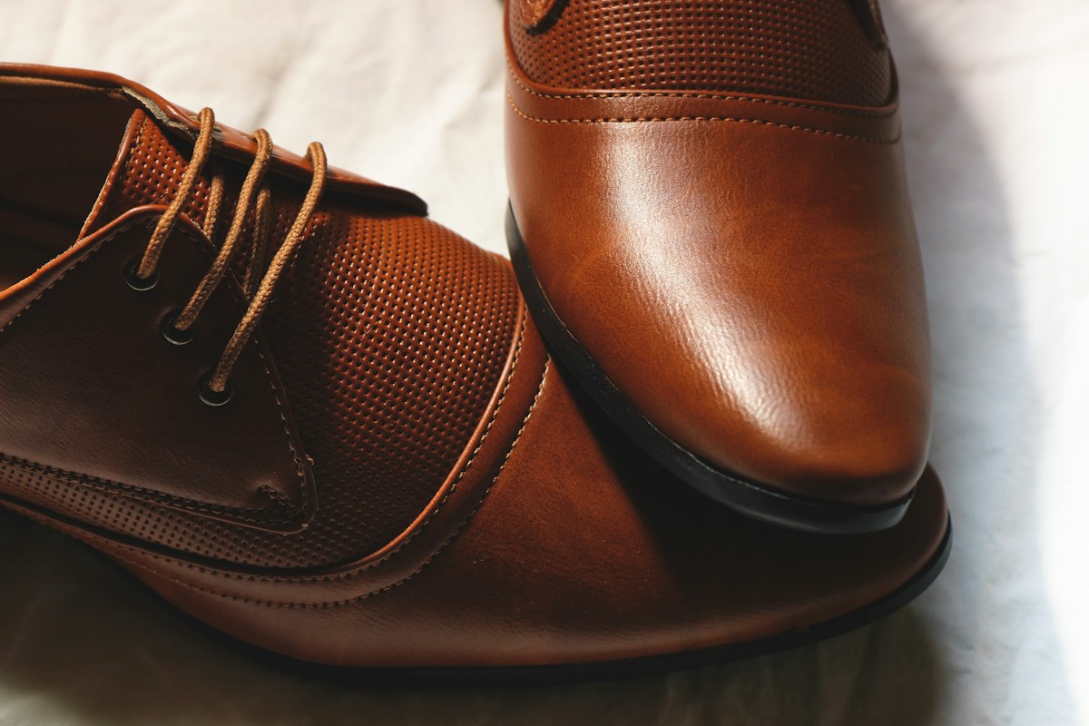 Close-up of polished leather dress shoes, the specialty of Italian shoe brands