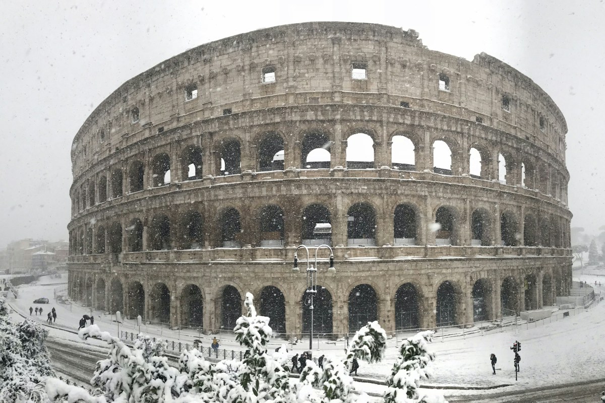 The Colosseum after a rare winter snowfall, a reminder that Italy in January can be cold