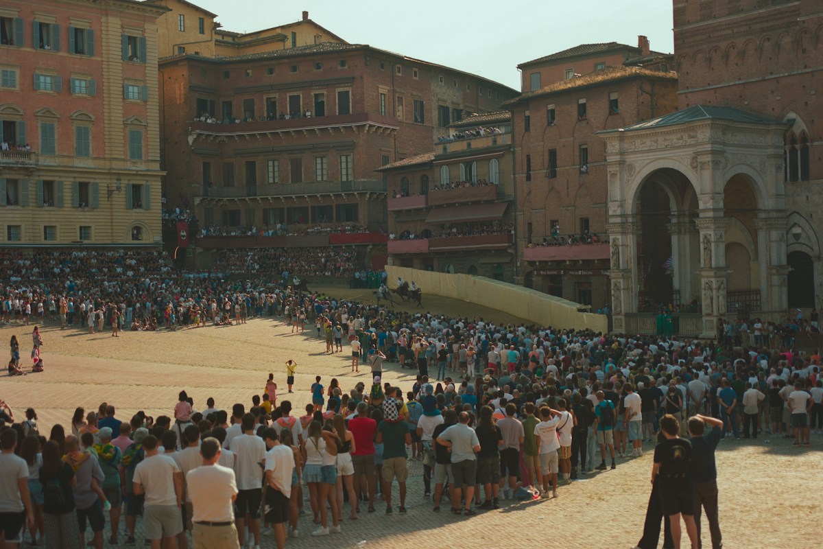 Crowds in Piazza del Campo in Siena for the Palio, a highlight of Italy in July