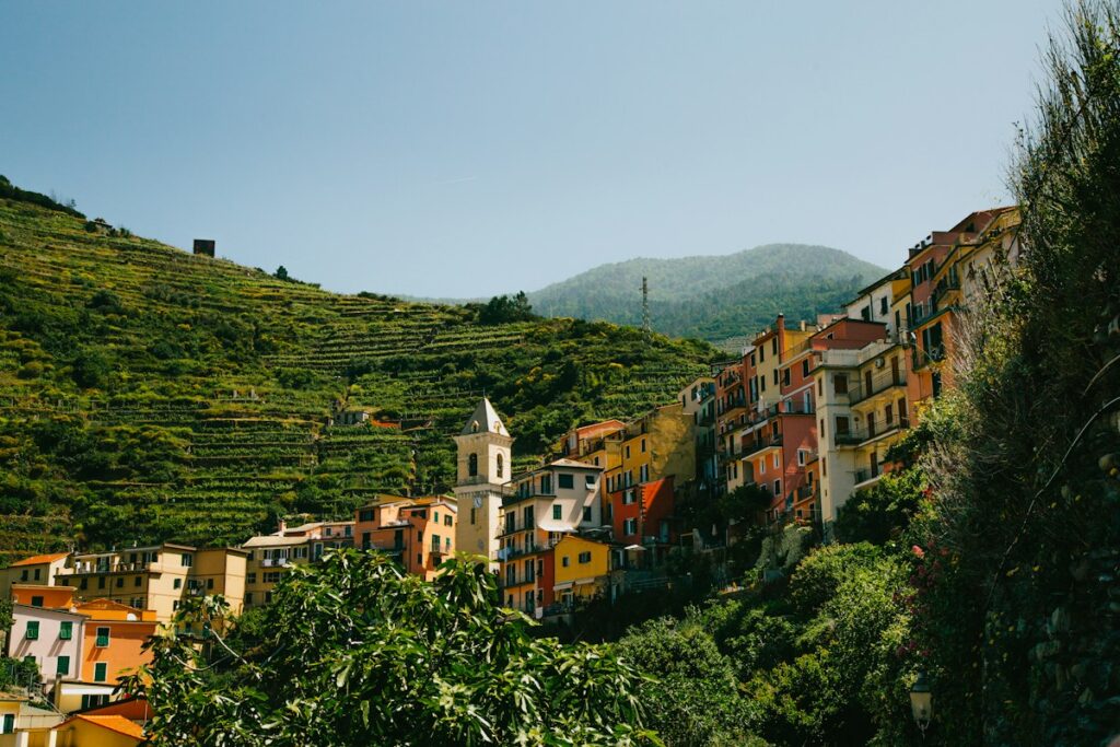 Green terraces and colorful houses in the Cinque Terre, a good choice for Italy in May
