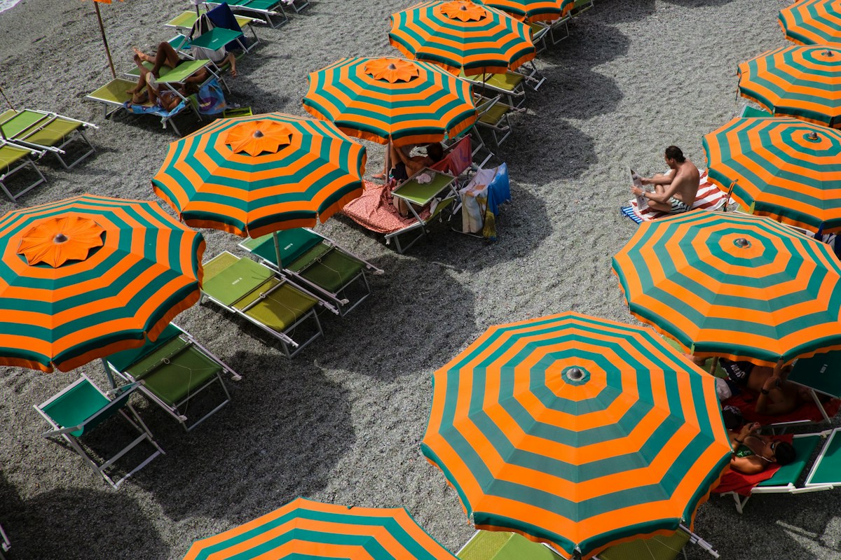Beach umbrellas at Monterosso al Mare, a typical scene of Italy in summer