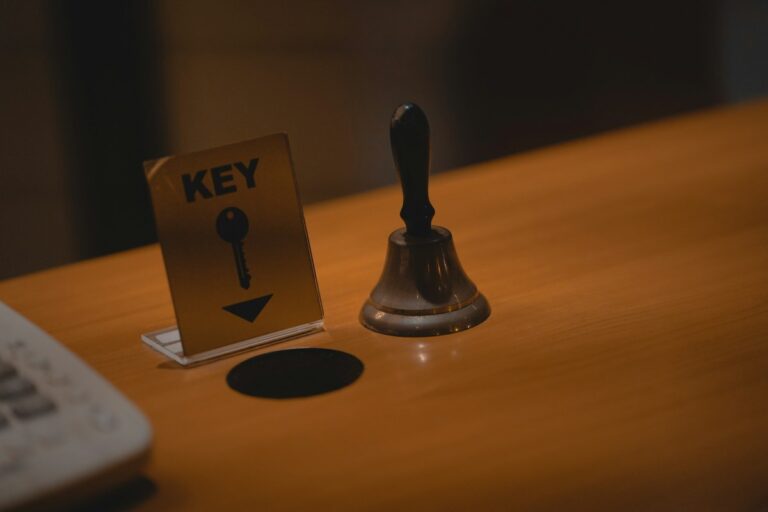 Hotel reception bell and key sign, where the Italy tourist tax is usually paid