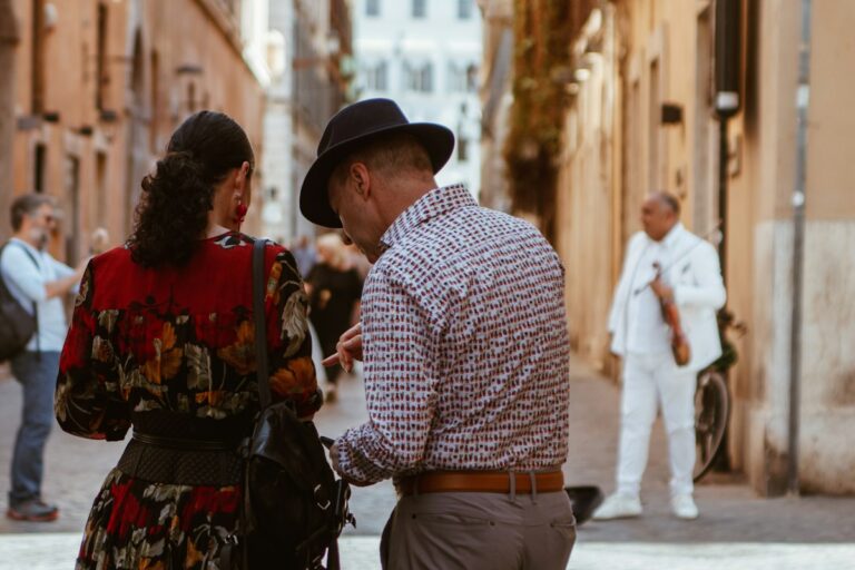 Couple planning their route near Piazza di Spagna in Rome, putting Italy travel tips to use