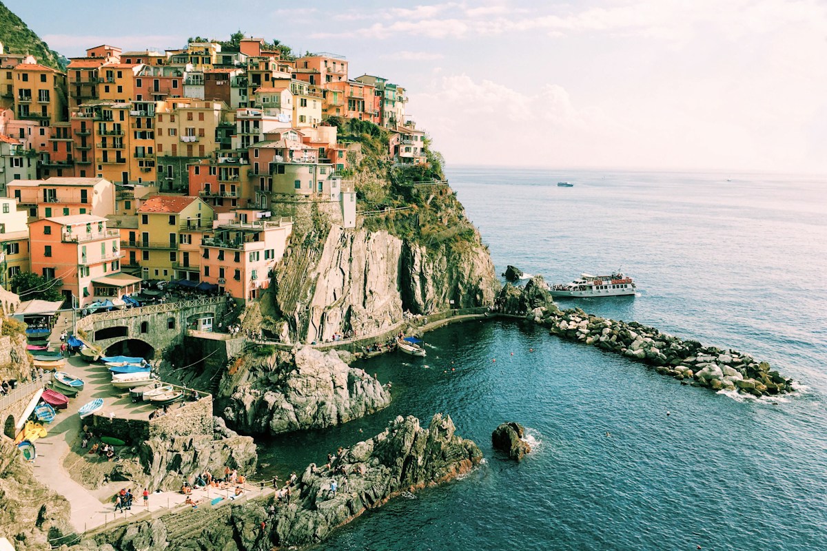 Colorful houses above the sea in Manarola, a scenic stop for Italy with kids