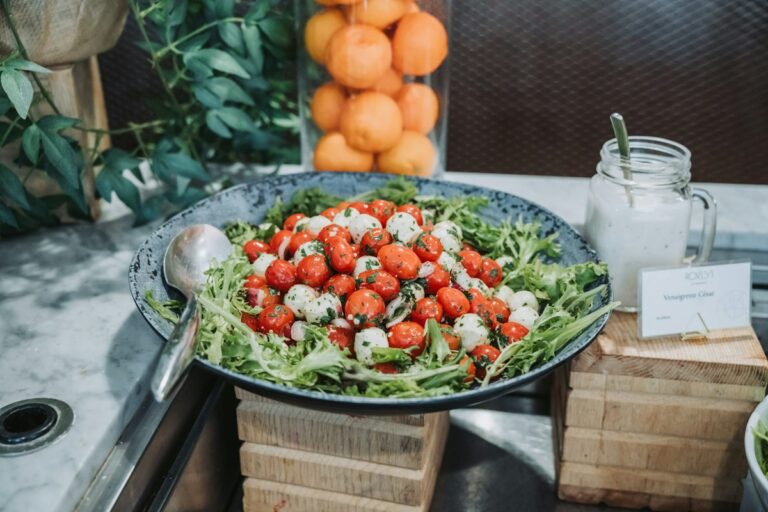 Mediterranean diet dish: cherry tomato and mozzarella salad with greens