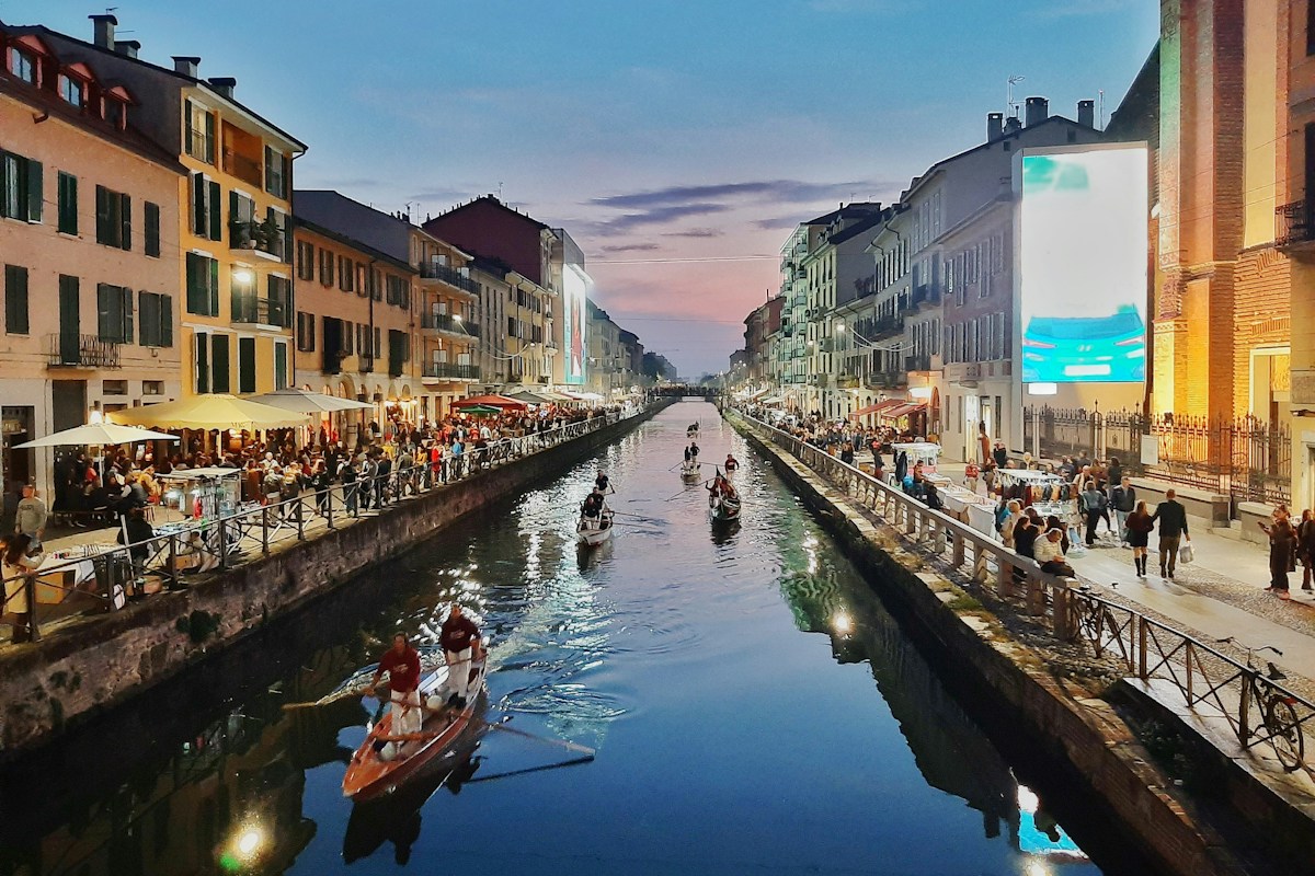 the Navigli canal in Milan at dusk, an area known for evening drinks