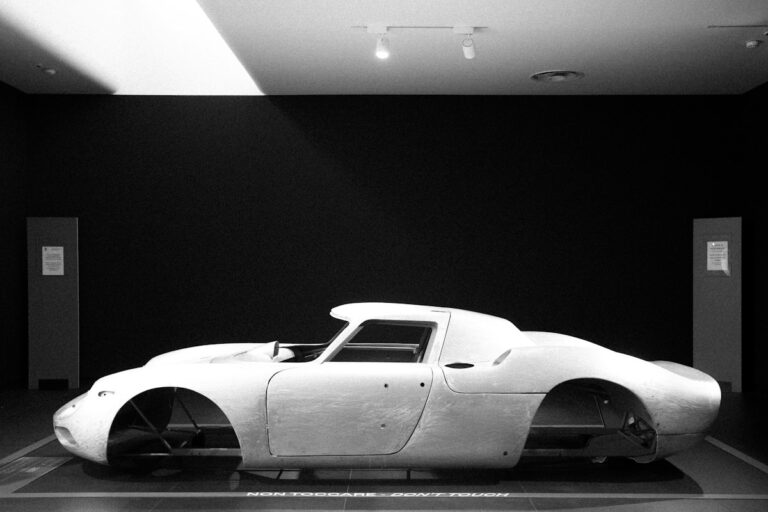 Classic sports car body on display in a car museum, the kind of exhibit Motor Valley Italy is known for
