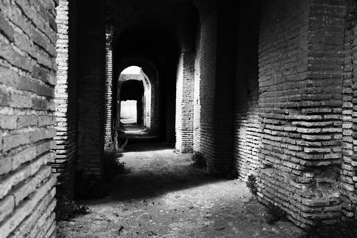 Ostia Antica: an ancient brick corridor with arched openings