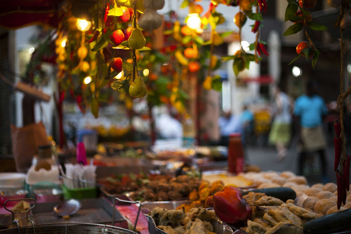 Palermo street food: a lit market stall with fresh produce in the historic center