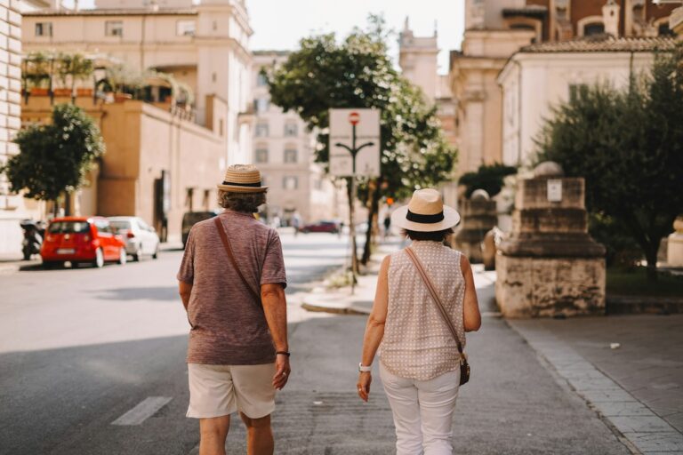 A couple walking down a street, exploring romantic places in Italy