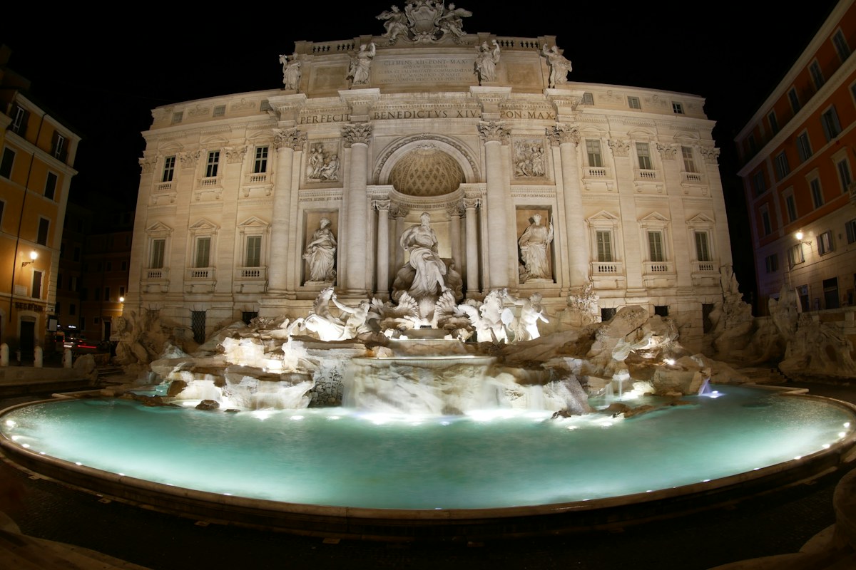 The Trevi Fountain lit up at night, a highlight of most Rome night tours