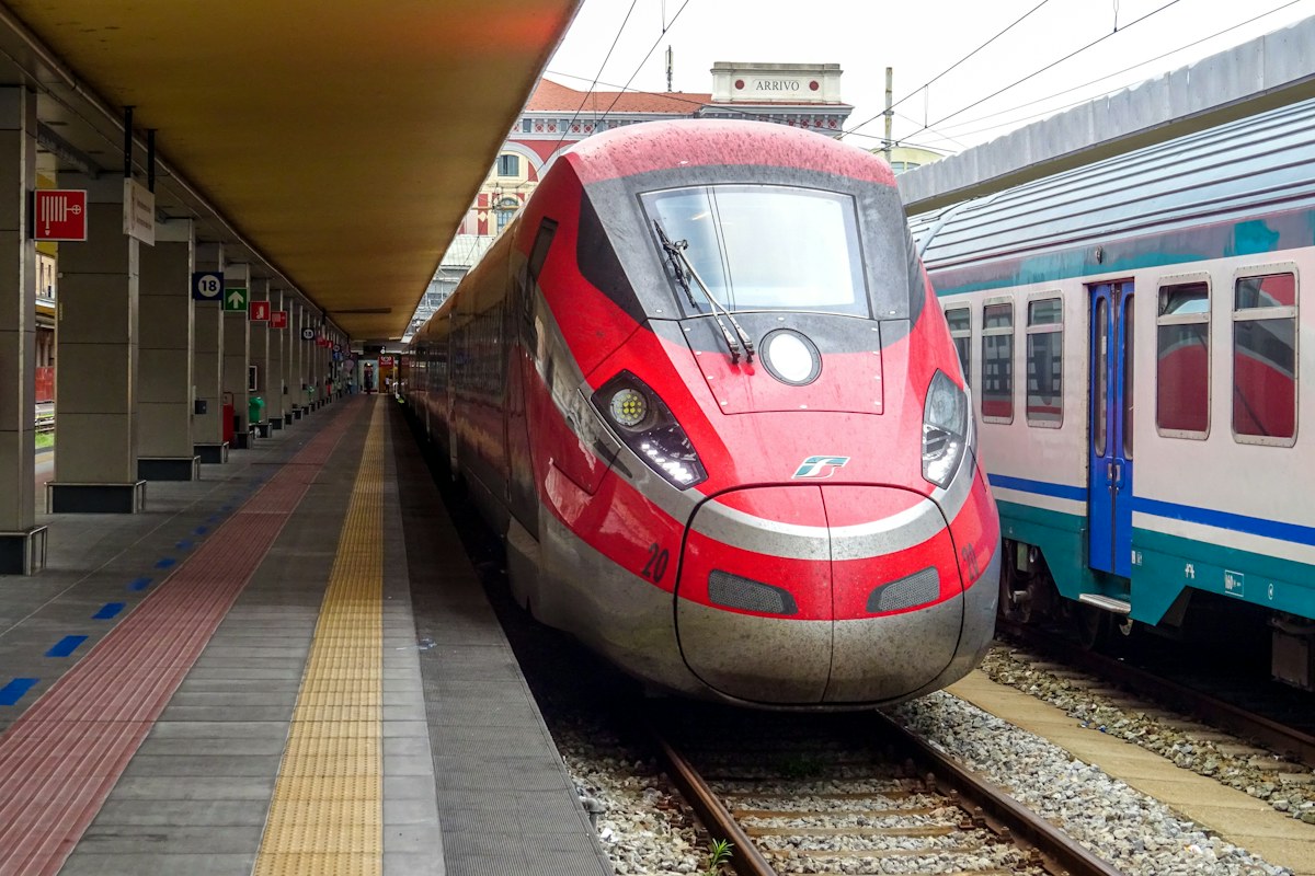 Rome to Florence train: a red high-speed train at a station platform in Italy