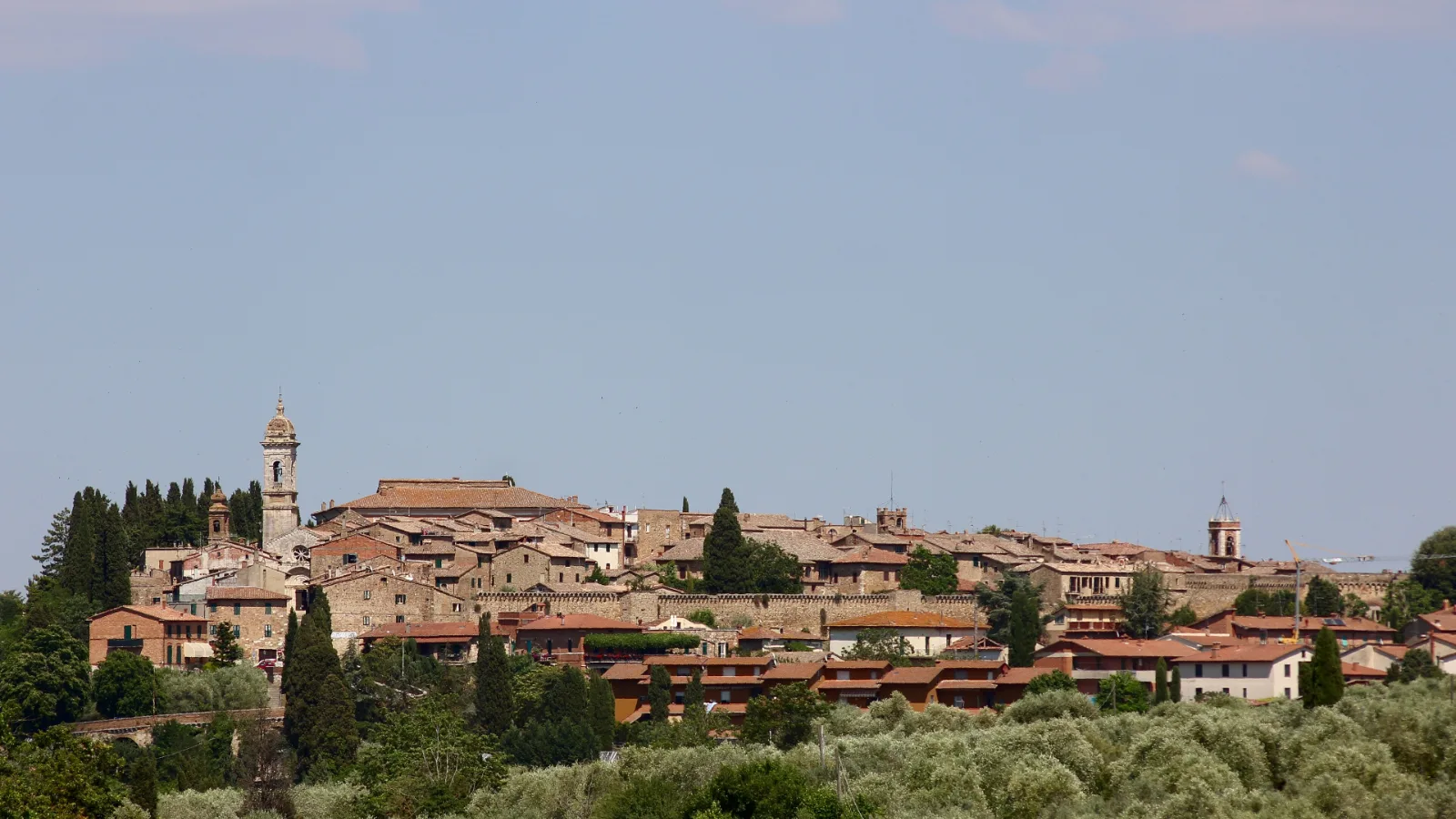 San Quirico d'Orcia seen from the surrounding Val d'Orcia countryside in Tuscany