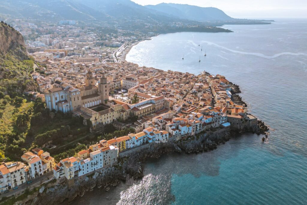 Aerial view of Cefalu and its bay on a Sicily itinerary