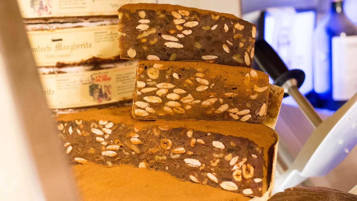 Panforte and panpepato on display in a food shop in Siena