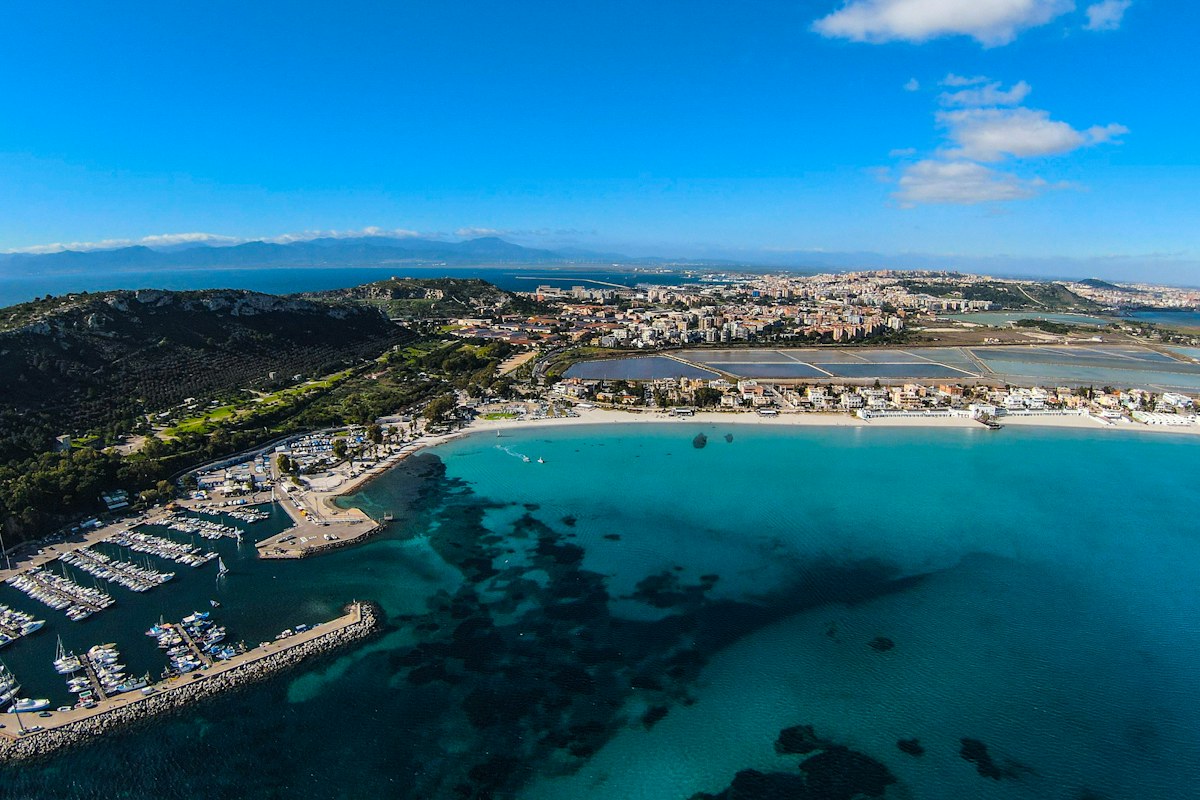 Aerial view of the beach and port, among the things to do in Cagliari