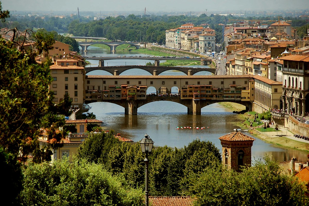 Things to do in Florence: the Ponte Vecchio over the Arno seen from the hills