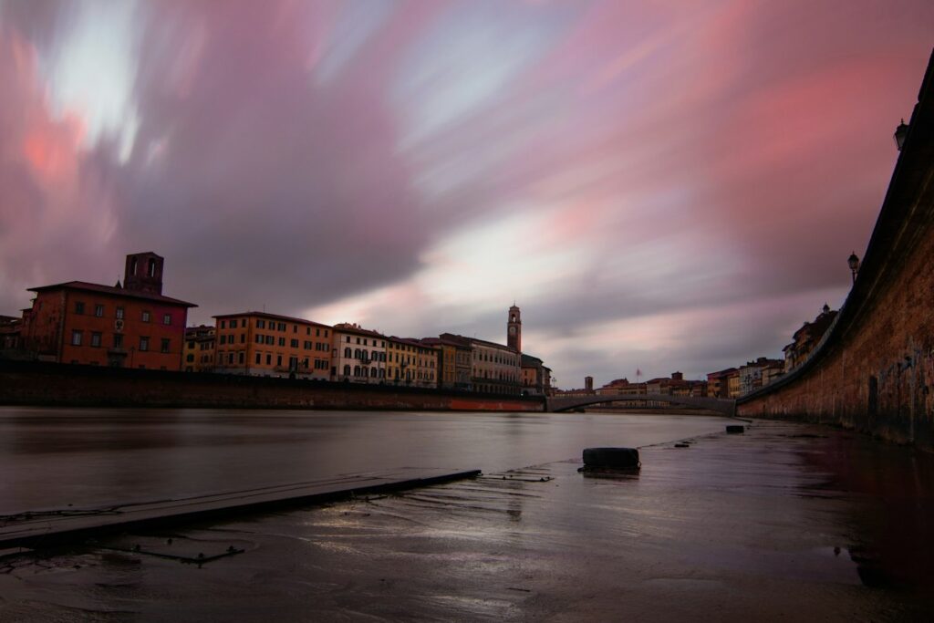 The calm Arno river through Pisa, a walk among the things to do in Pisa beyond the tower