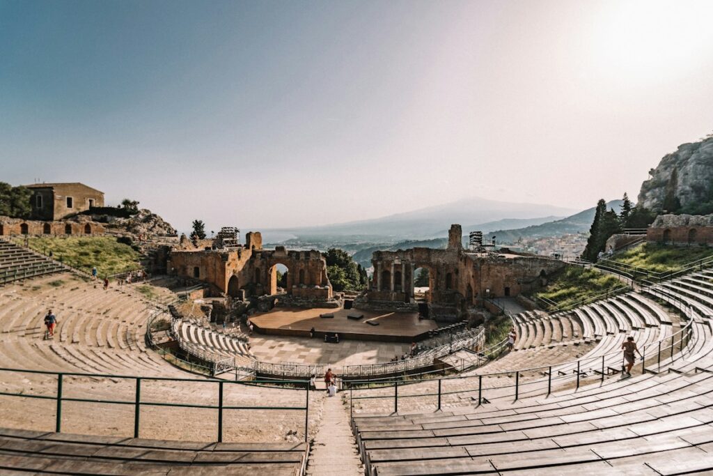 Historic buildings among trees, part of things to do in Taormina