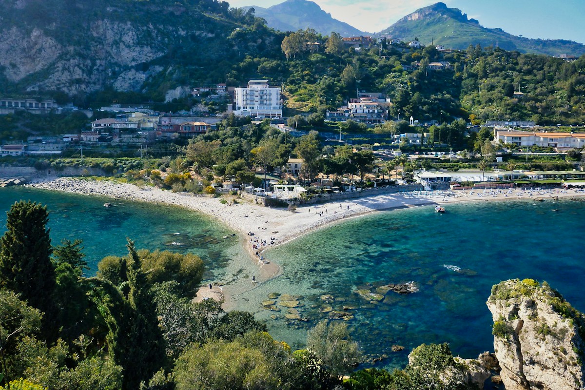Aerial view of Taormina above the sea, with things to do in Taormina