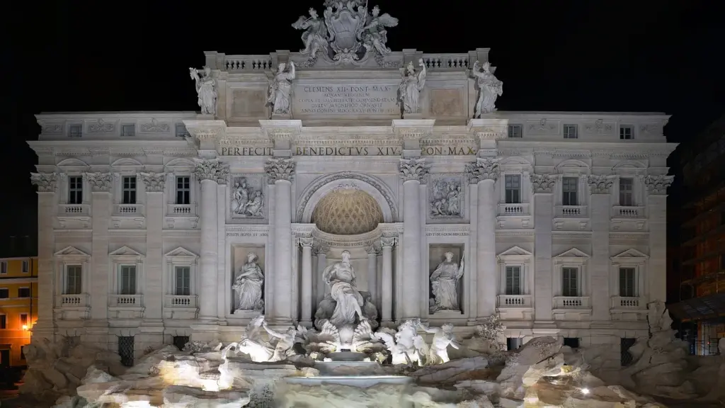 The Trevi Fountain lit up at night in Rome, a stop on New Year's Eve walks