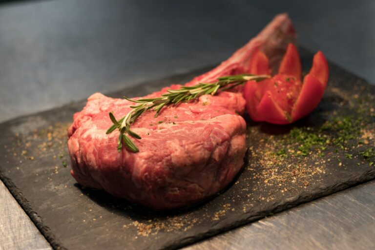 Tuscan food: a thick bone-in steak with rosemary, ready for the grill