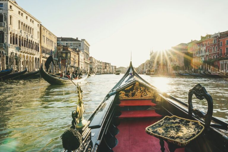 View from a gondola on a Venice canal at golden hour, the ride covered by our Venice gondola ride cost guide