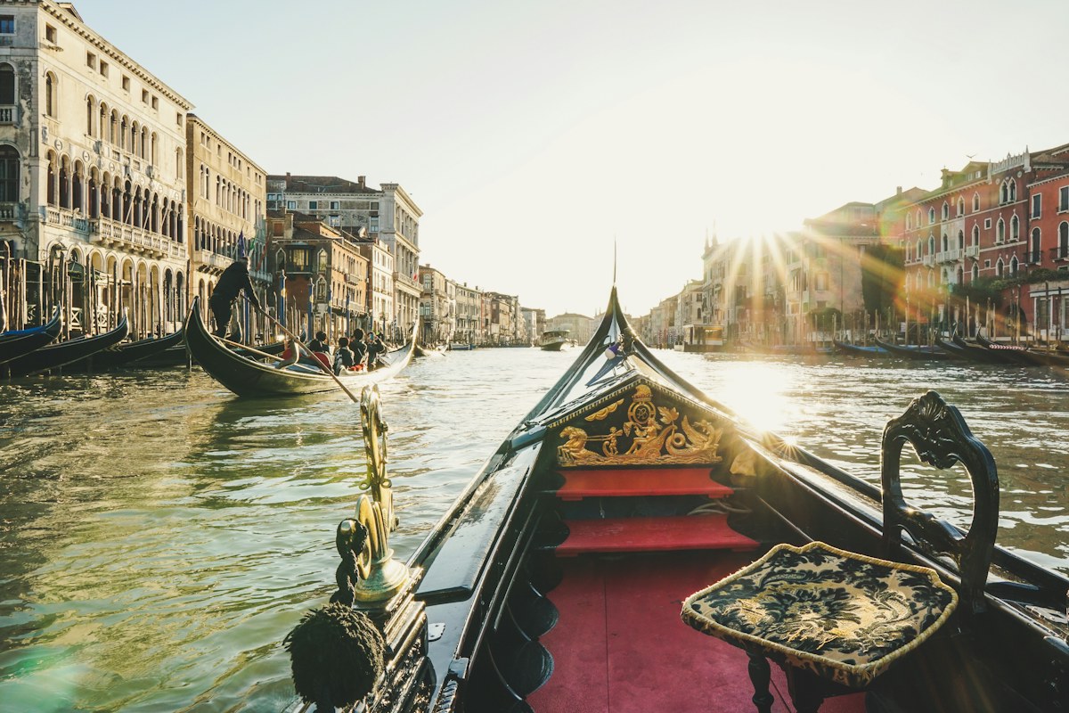 View from a gondola on a Venice canal at golden hour, the ride covered by our Venice gondola ride cost guide
