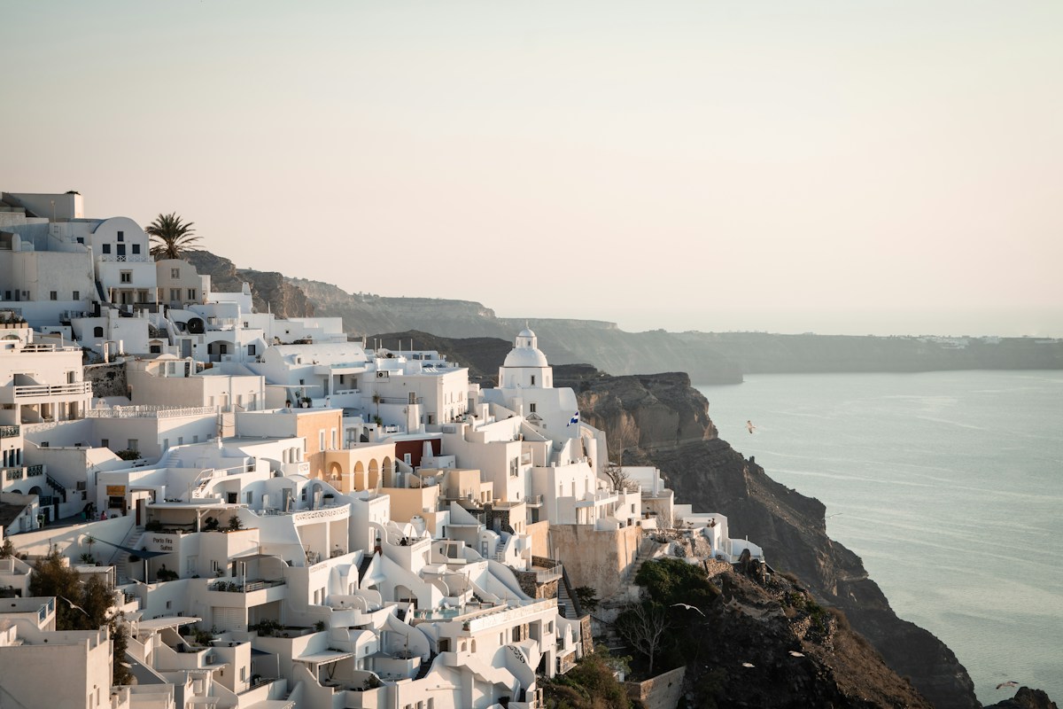 Clifftop village overlooking the blue Mediterranean Sea in Greece