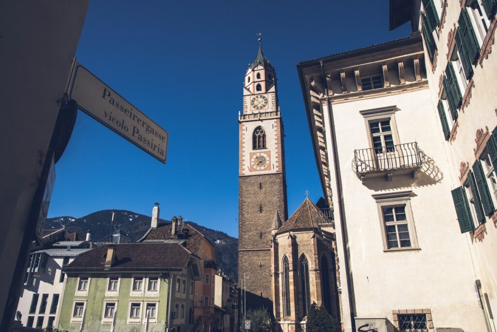 The bell tower of St. Nicholas Church above the old town of Merano in South Tyrol