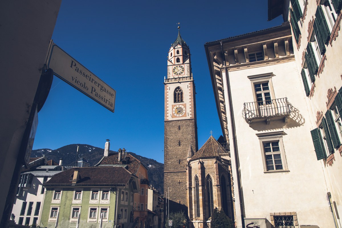 The bell tower of St. Nicholas Church above the old town of Merano in South Tyrol